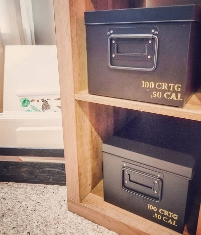 A "shot" of desk organization was created in this hunting themed room with fake ammo boxes made with metal boxes, stencils and paint.