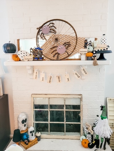 Classic white, orange and black Halloween mantel with pops of blue