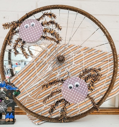 A Bike Wheel Rim Gets New Life As A Web On This Halloween Mantel