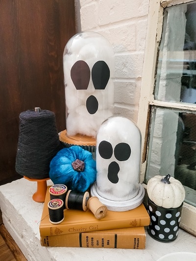 Classic white, orange and black Halloween mantel with pops of blue