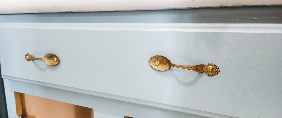 Add unique handles or drawer pulls to your piece by using spoons.