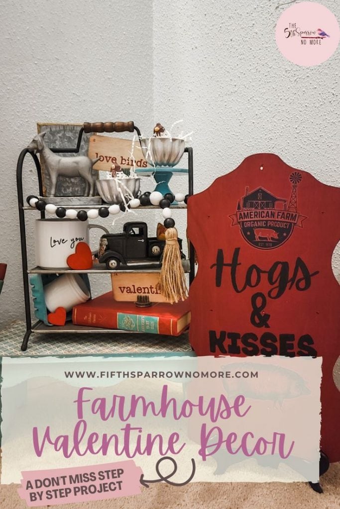 Red Valentines sign that says hogs and kisses and tiered tray with vintage flashcards and thrifted items
