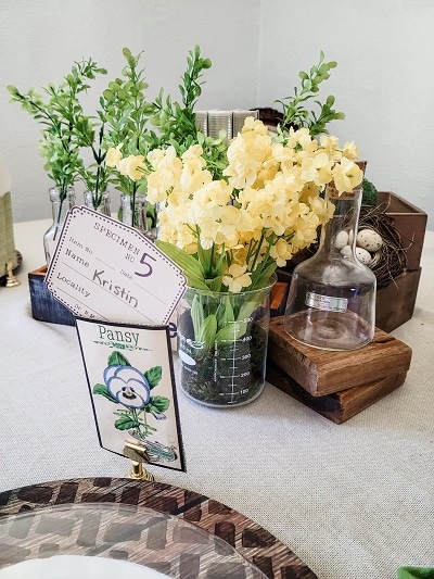 Create a Spring table inspired by botanical prints with vintage specimen labels