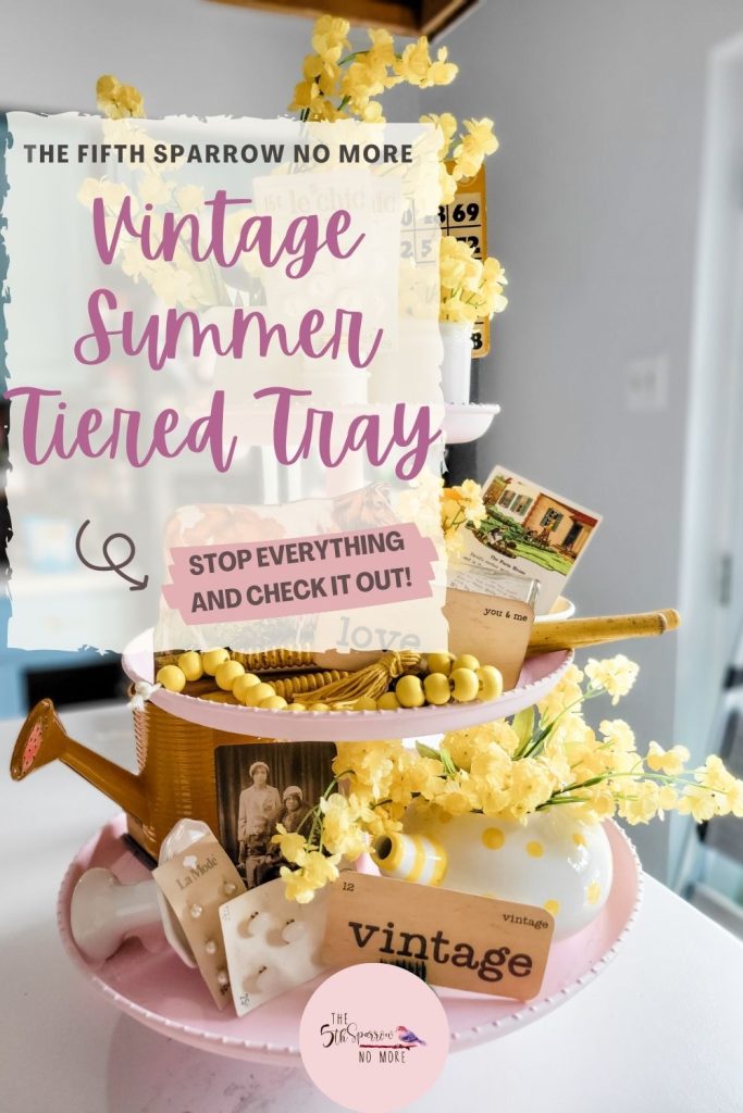 How do you style a three tiered tray for a vintage farmhouse Summer? With sunny pops of yellow, vintage flash cards, old buttons, toys and milk glass.