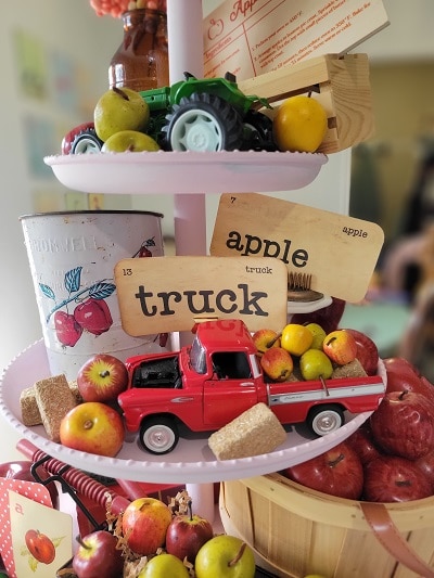 Use old toys and kitchen items on vintage apple tiered tray
