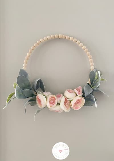 A bead wreath with ranunculus and lamb's ear