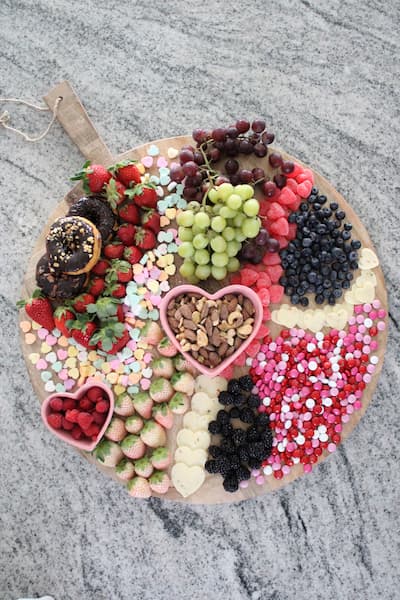 Charcuterie Board with fruit sweets cheese and nuts