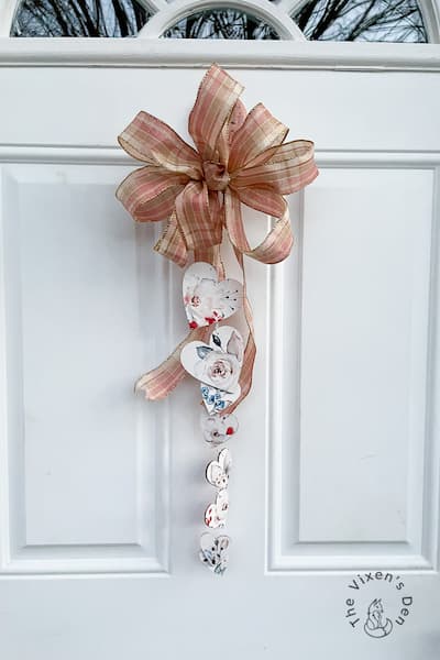 Door hanger with bow and hearts