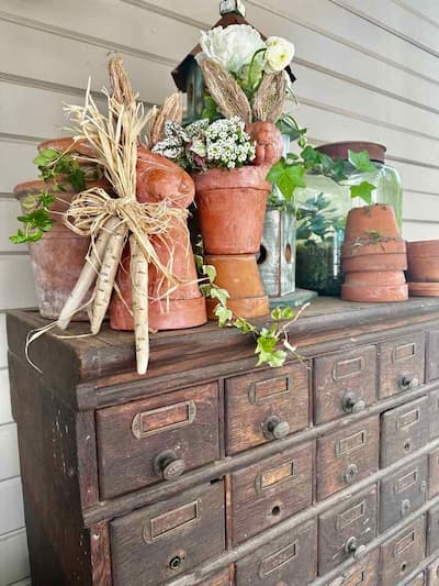Terra Cotta Pots With white and green floral on card catalog