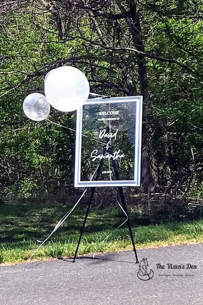 Glass chalkboard on easel with balloons