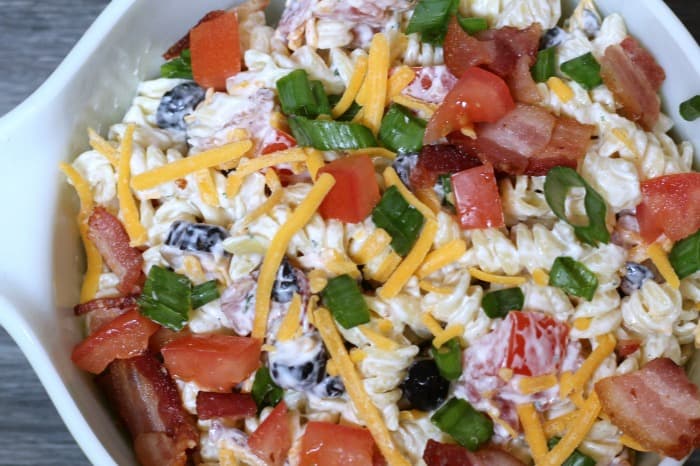 pasta salad with tomatoes, cheese, bacon