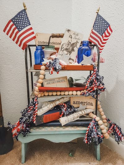 A patriotic tiered tray with vintage accents, a bead garland, flash cards from Twigs & Fluff.