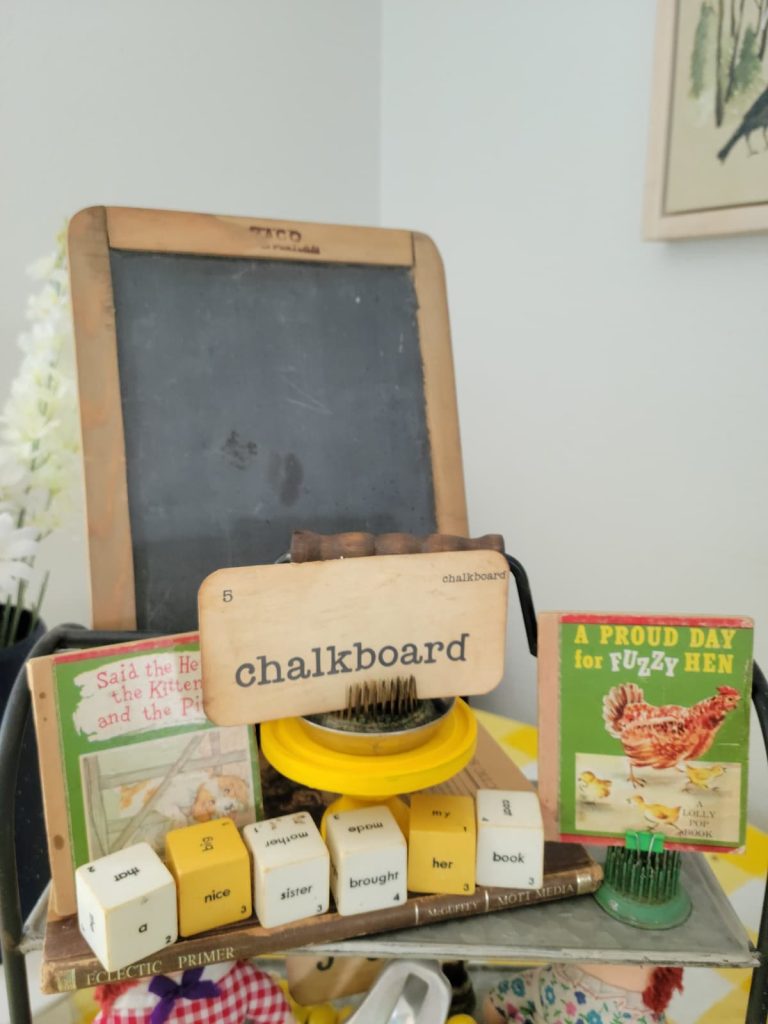 Top of Tiered Tray with vintage chalkboard flash card, chalkboard children's books and blocks