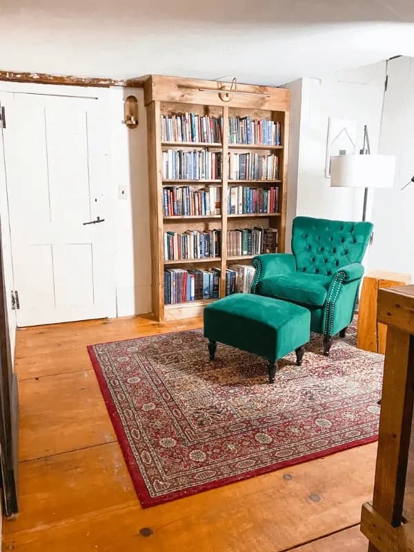 Library and green chair in a landing area