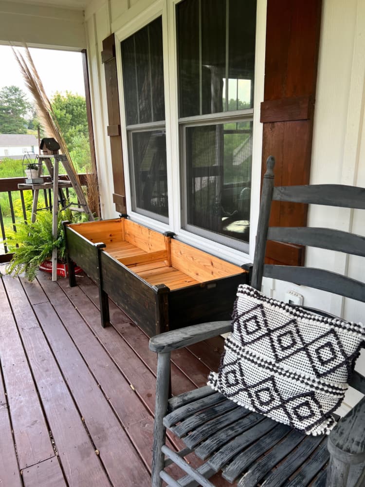 porch with potting table and rocking chair