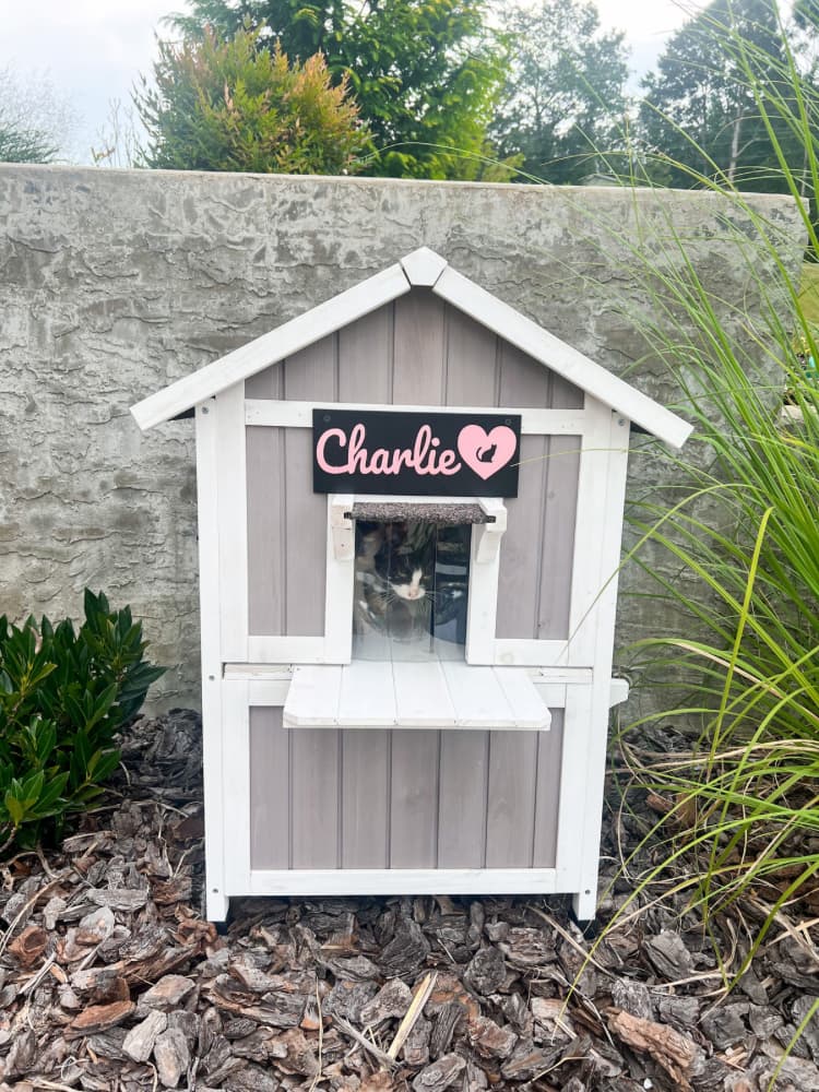 wood gray cat house with pet name sign