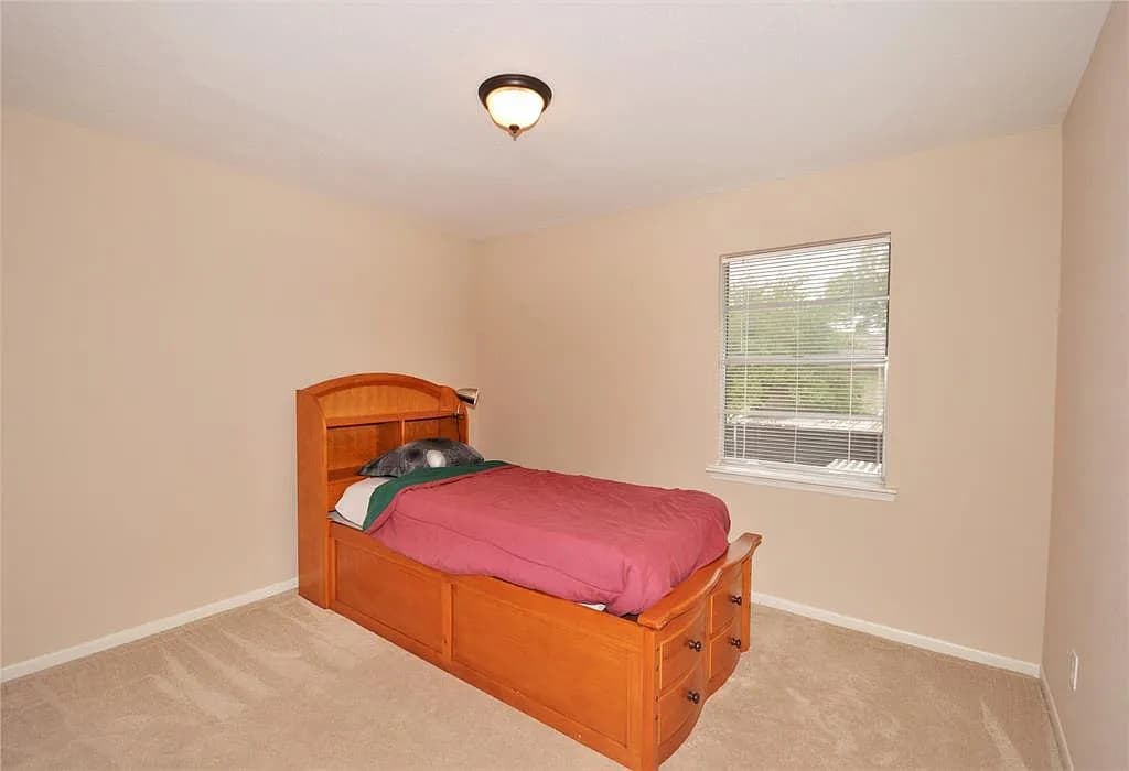 Bed in room with brown walls