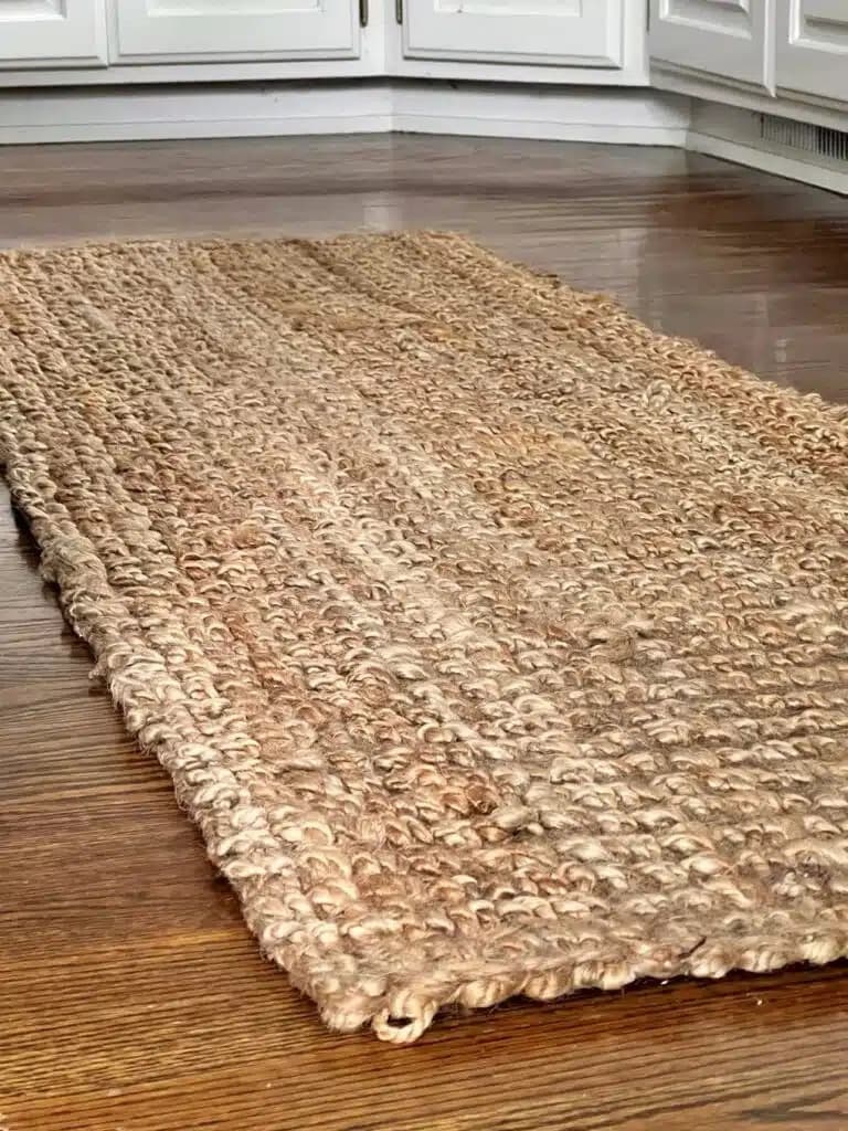 brown woven rug on brown wood floor