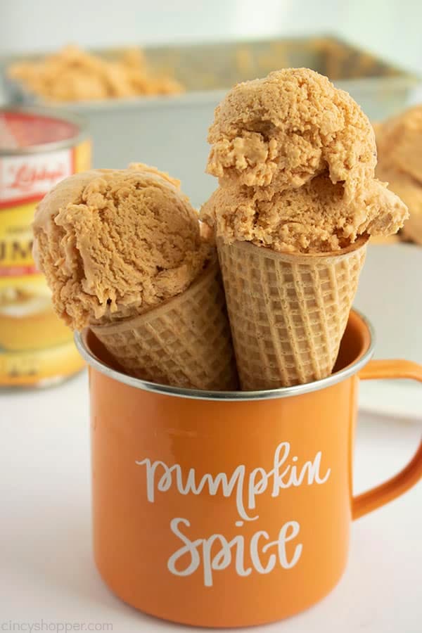 Pumpkin ice cream in cones in a pumpkin spice mug