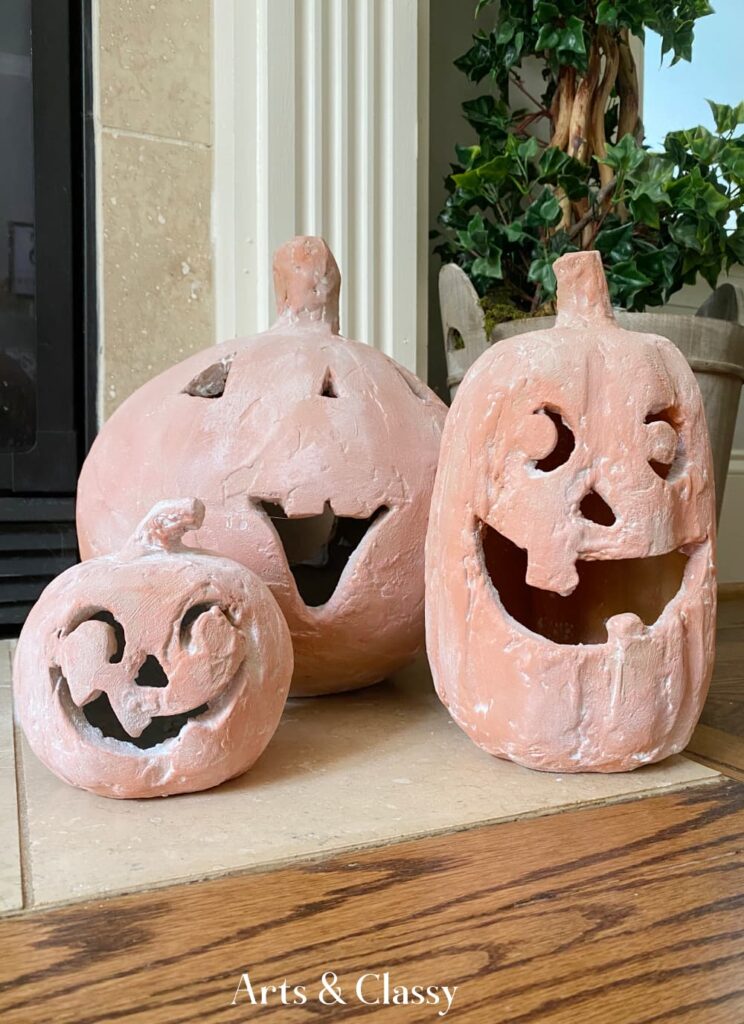 three terracotta pumpkins