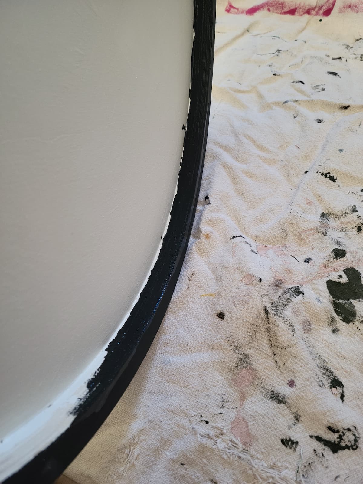 wood round with black paint