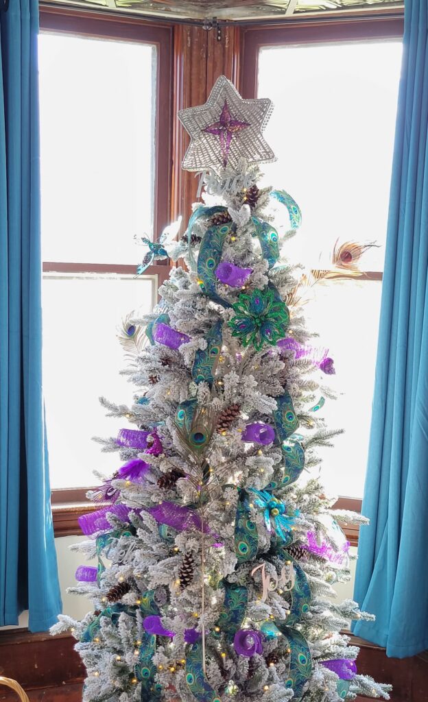 Christmas tree with peacock decorations