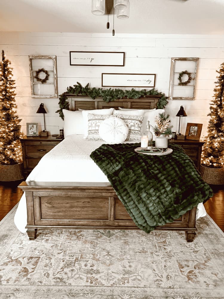 bedroom with Christmas trees and decorating