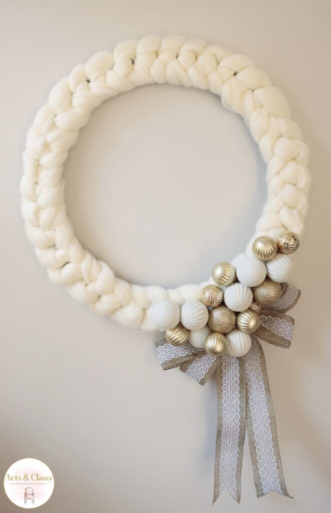 yarn wreath with gold and white ornaments