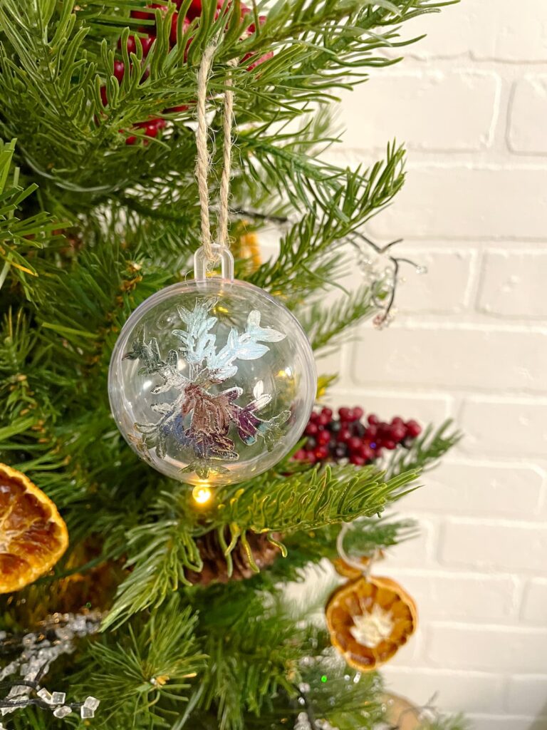 clear glass ornament with silver snowflake