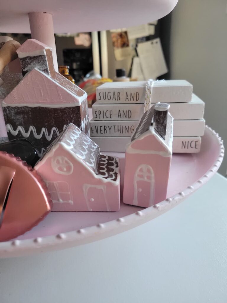 gingerbread houses and faux book stack on tiered tray