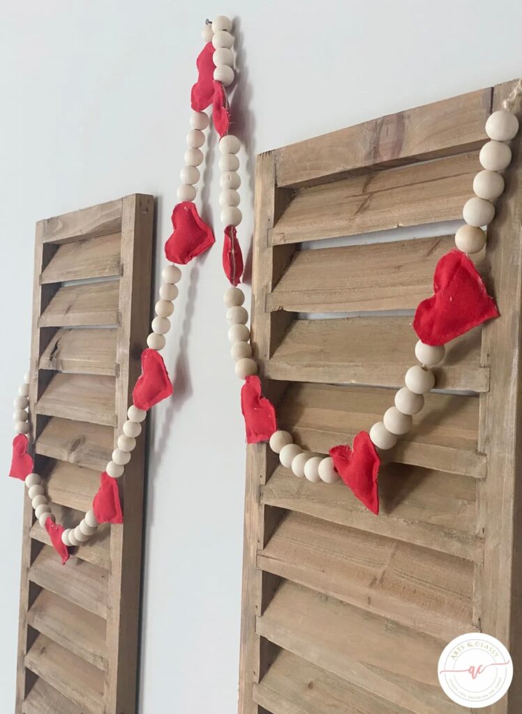 wooden shutters with bead and heart garland