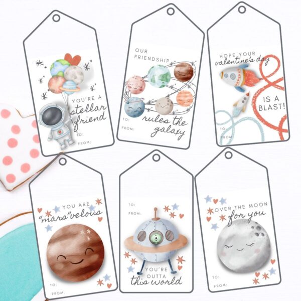 I am so excited to share these space-themed valentine cards, tags, and bag toppers with all of you! They are designed with a rocket ship or two, the solar system, an astronaut and an alien and his spaceship. These are beautiful watercolor images, not so much silly outer space, so even if you have older girls and boys who are into all things space these will be perfect!