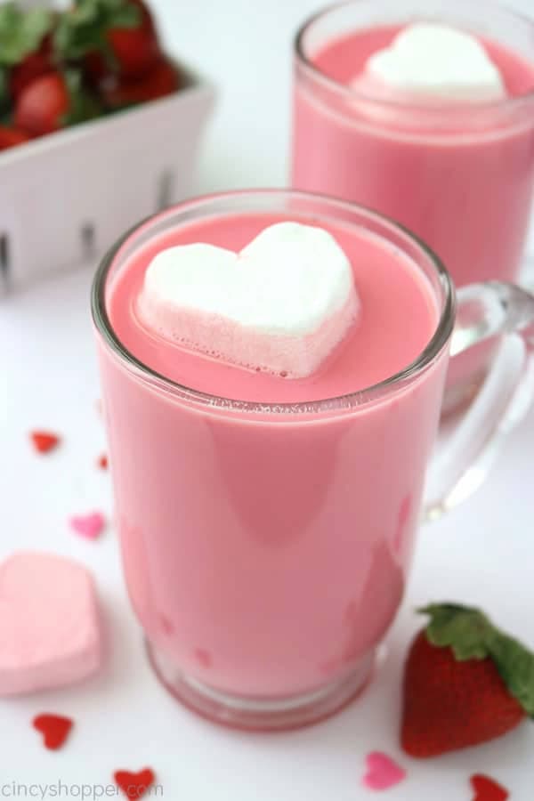 clear mug of pink hot chocolate with strawberry marshmallow