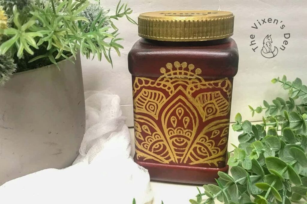 brown jar with gold line design