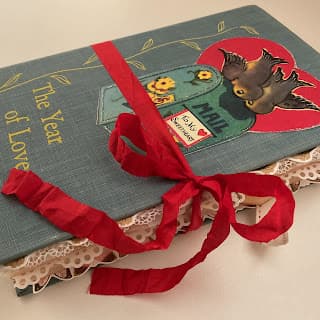Turquoise book with red ribbon