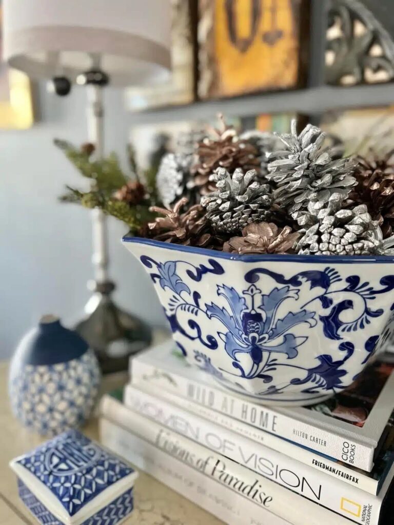blue and white bowl with pinecones