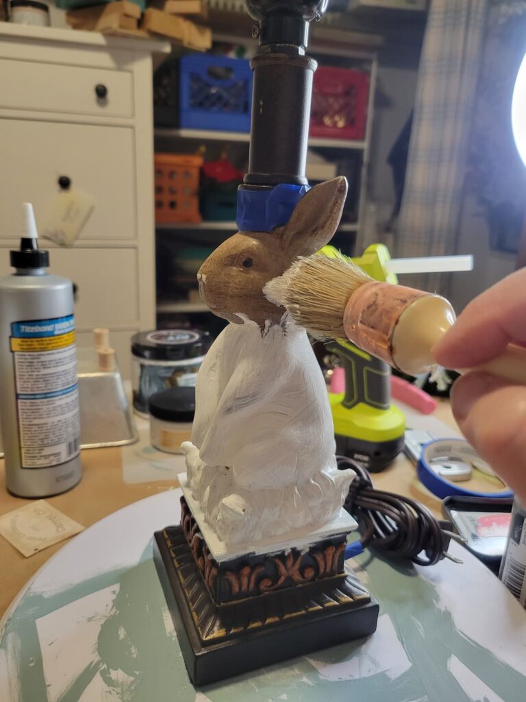 Painting a brown rabbit lamp