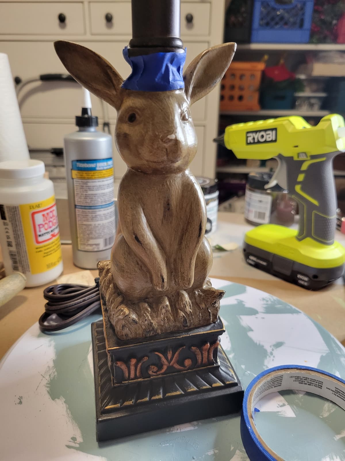 front of brown bunny lamp with painter's tape