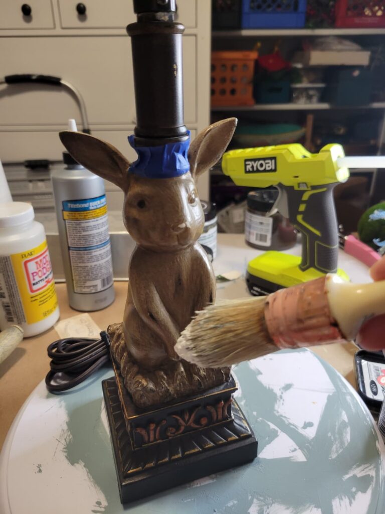 brown rabbit lamp and painting with brush