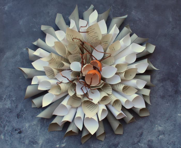 Book page wreath with eggshells in middle