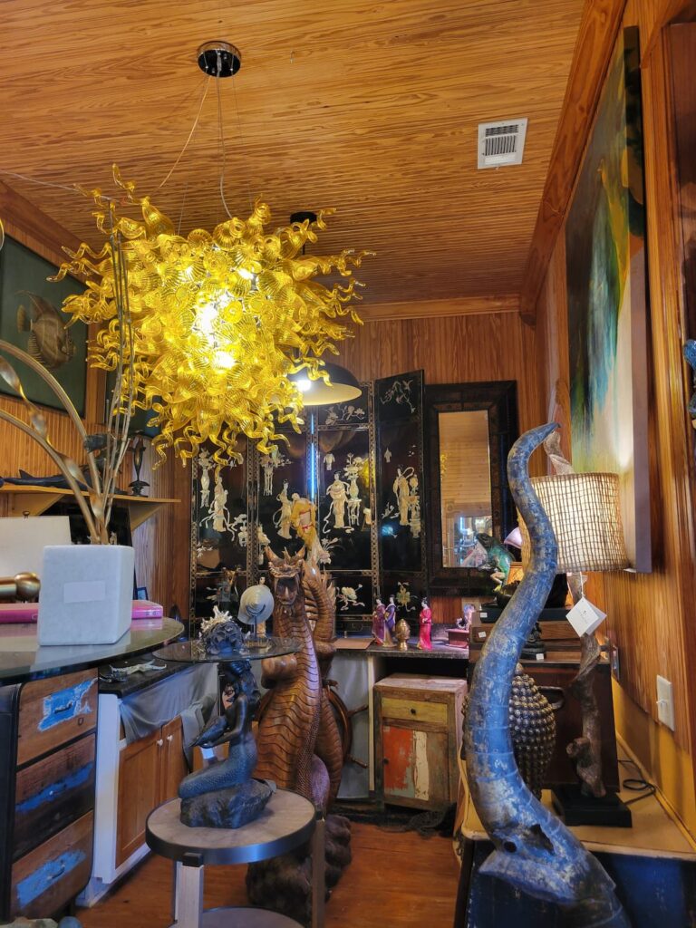 Chandelier of glass in room of unique antiques