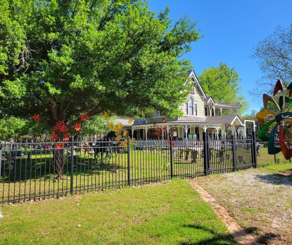 Victorian home behind fence