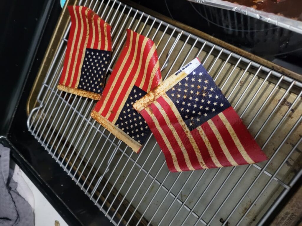 coffee dyed flags drying on rack
