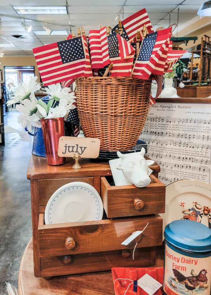 basket of flags on small wood dresser