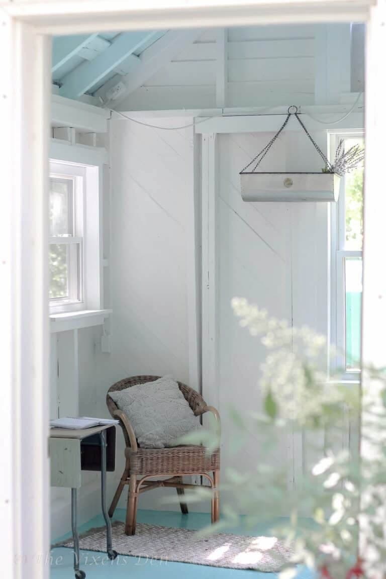 white room with wicker chair