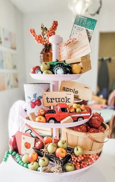 tiered tray with apples and vintage flashcards