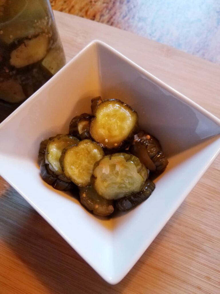 pickle slices in white bowl