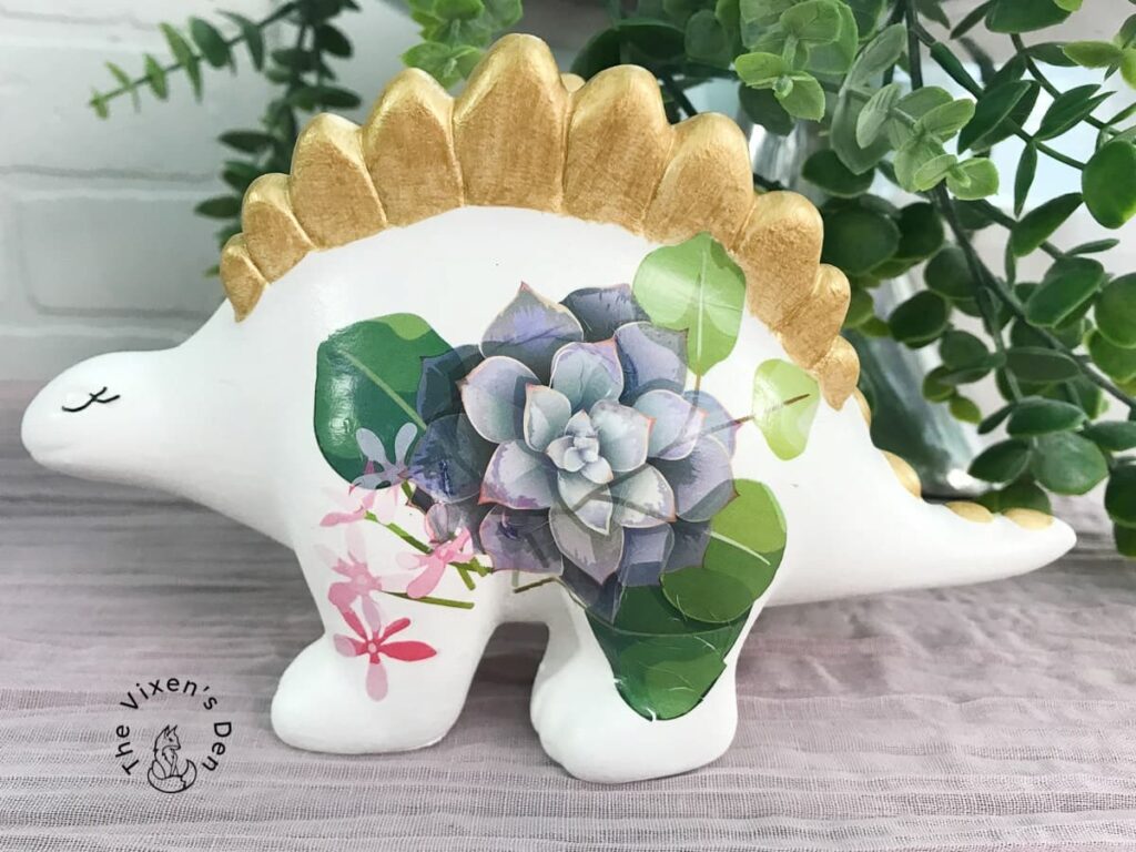 ceramic dinosaur with gold and a transfer