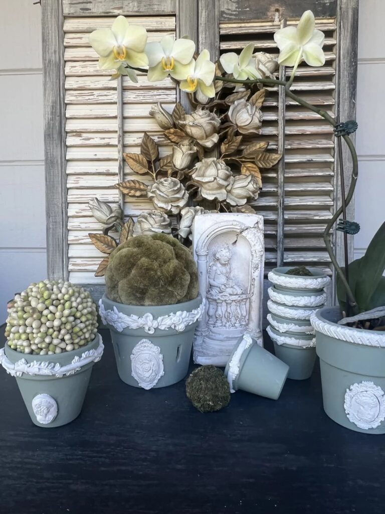 Green pots with greenery