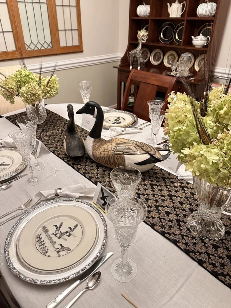 Table with bird plates and centerpiece